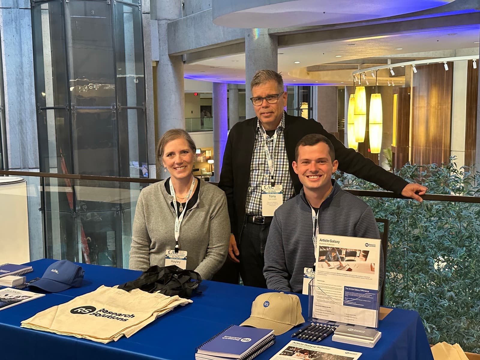 Team members at the Research Solutions booth at a library conference