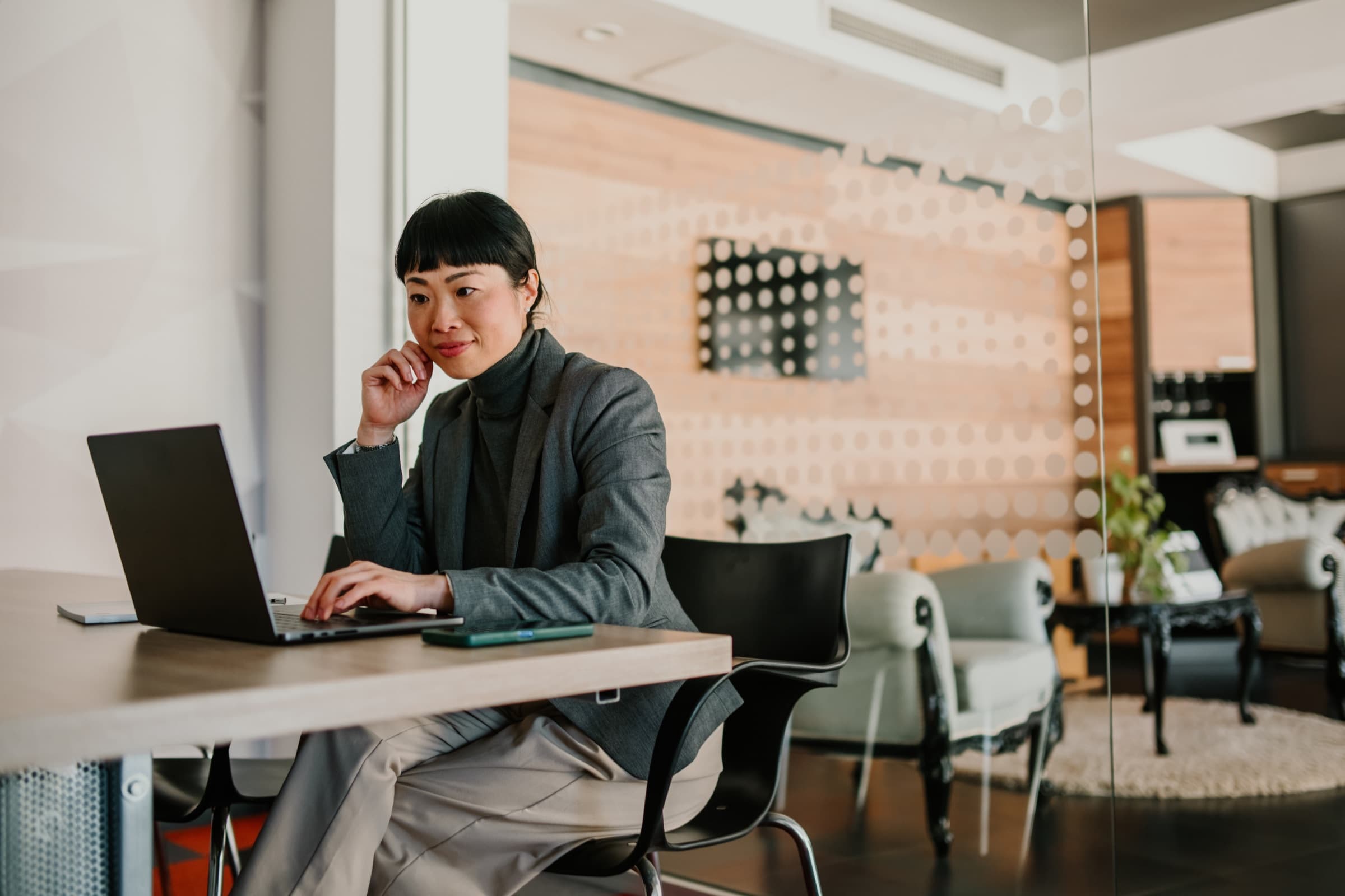 Research professional working at a laptop